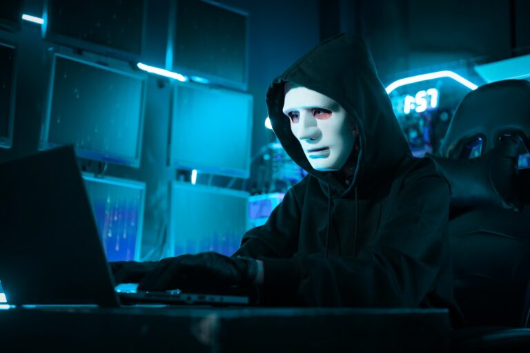 A Hacker is using laptop computer to steal data