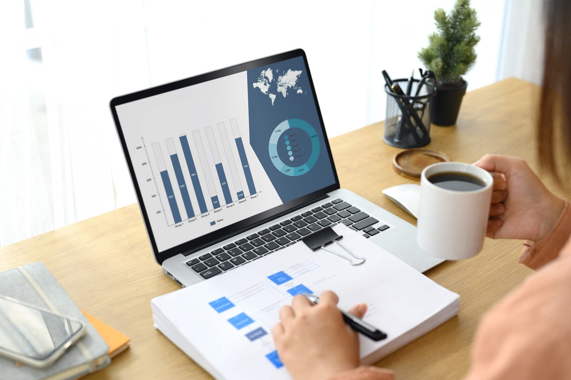 Professional businesswoman reviewing detailed analytics displayed on laptop screen